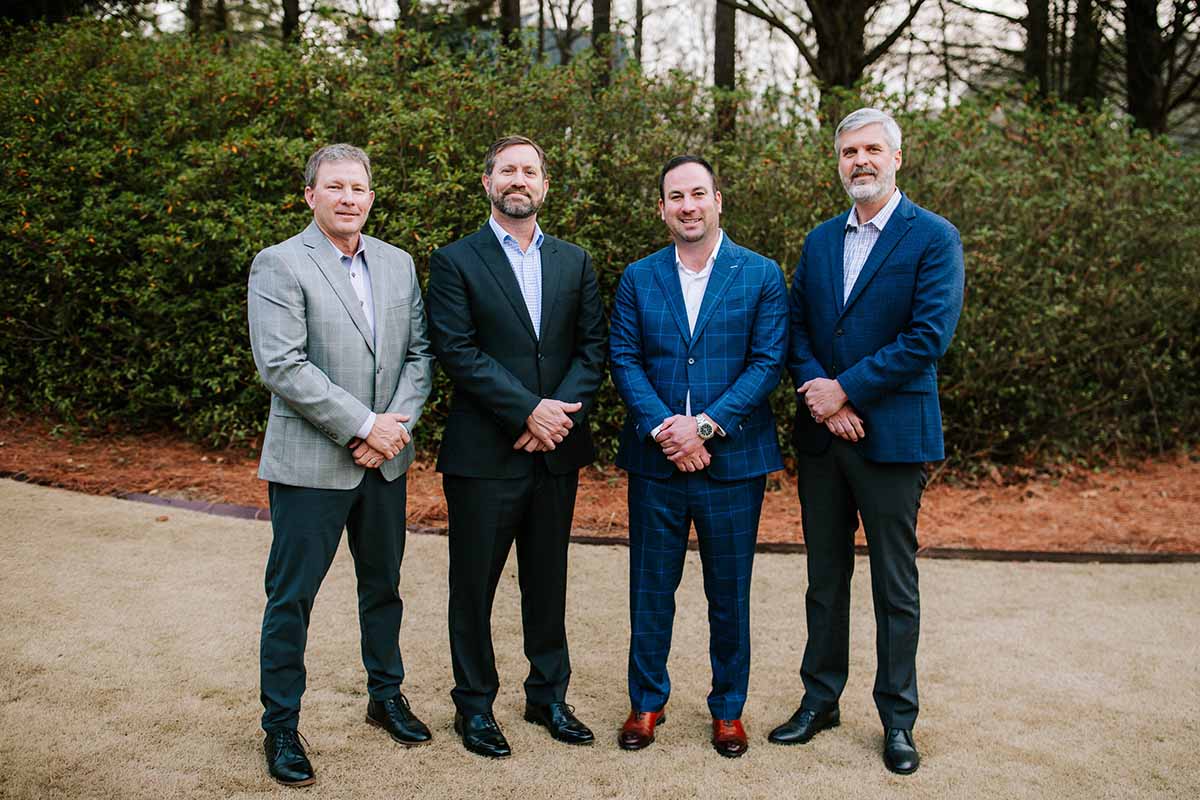 Orbit Real Estate Partners team standing together outdoors